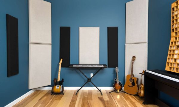 Lesson Room C Closer View β True Music Studios Closer shot of Room C corner with upright piano and wood panel acoustic treatment.